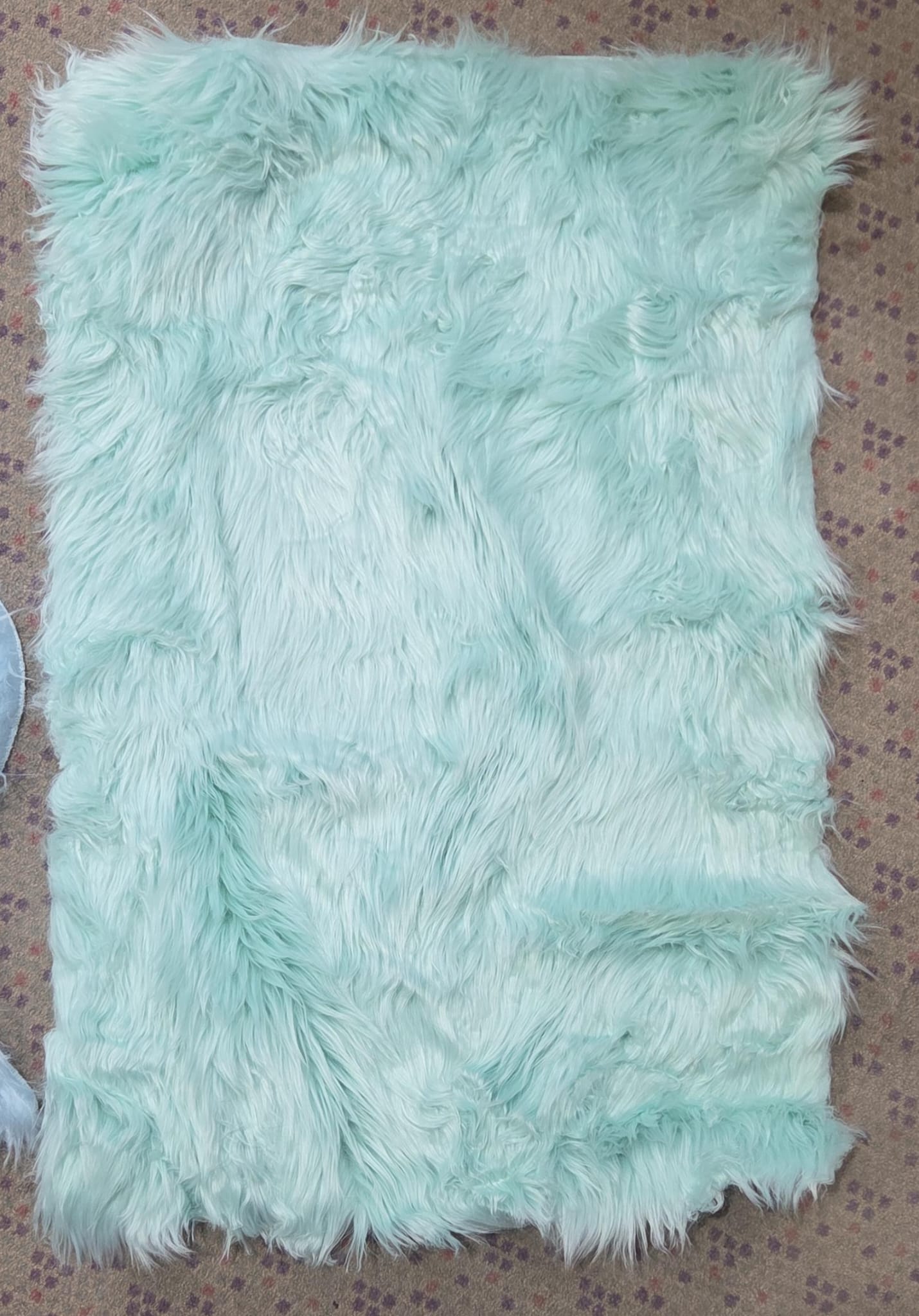 Blue faux fur rug.
